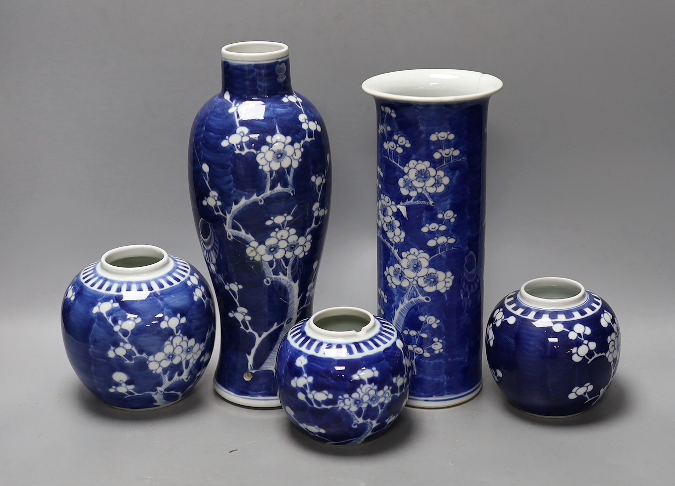 Two 19th / 20th century Chinese blue and white prunus vases and three jars, tallest 29cm